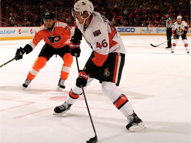 Patrick Wiercioch #46 of the Ottawa Senators takes the puck as Chris Vande Velde #76 of the Philadelphia Flyers defends.
