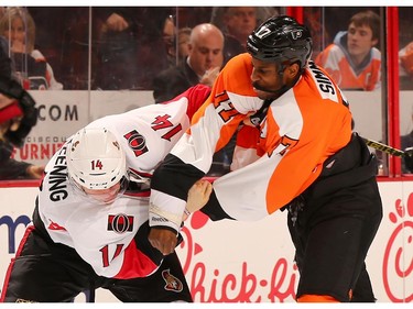 Colin Greening #14 of the Ottawa Senators and Wayne Simmonds #17 of the Philadelphia Flyers fight in the second period.