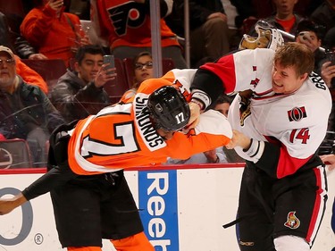 Colin Greening #14 of the Ottawa Senators and Wayne Simmonds #17 of the Philadelphia Flyers fight in the second period.