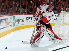 Craig Anderson #41 of the Ottawa Senators clears the puck in the second period.