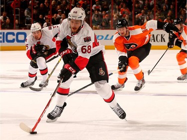 Mike Hoffman #68 of the Ottawa Senators heads for the net as Sean Couturier #14 of the Philadelphia Flyers defends.