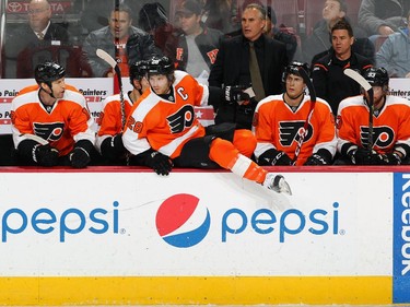 Claude Giroux #28 of the Philadelphia Flyers, in his first game back after an injury, jumps onto the ice surface during the first period.