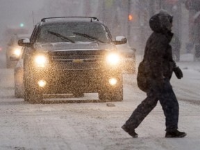 Pedestrians make their way along Somerset Street at Bank Street on Jan. 3.