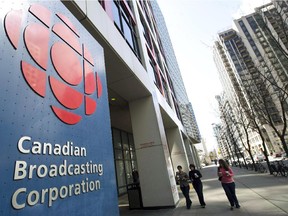People walk into the CBC building in Toronto on April 4, 2012. The CBC says it will no longer approve any paid appearances by its on-air journalistic employees. The embattled public broadcaster issued the directive in a memo to staff on Thursday, saying "paid appearances can create an adverse impact on the corporation."
