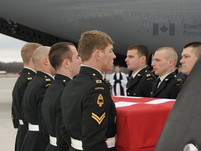 English/Anglais
TN2010-0086-10
February 15, 2010
8 Wing/CFB Trenton

The Bearer Party lower their fallen comrade, Corporal Joshua Caleb Baker to an awaiting hearse on the ramp at 8 Wing, Trenton.

Cpl Baker, a member of The Loyal Edmonton Regiment (4th Battalion Princess Patricia’s Canadian Light Infantry), from Edmonton, Alberta, is repatriated to Canada in a ceremony at 8 Wing Trenton in Ontario on February 15th, 2010
 
Cpl Baker was killed in a training accident on a range located approximately 4 km northeast of Kandahar City. The accident took place at about 5:00 p.m., Kandahar time, on 12 February 2010.
 
This accident is non-battle related and an investigation by the Canadian Forces National Investigation Service (CFNIS) is under way to determine the circumstances.

Photo by: MCpl Miranda Langguth

French/Français
TN2010-0086-10
15 février 2010
8e Escadre/BFC Trenton

Les transporteurs déposent la dépouille mortelle de leur camarade, le Caporal Joshua Caleb Baker, dans un corbillard, à la 8e Esca