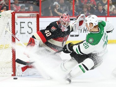 Robin Lehner of the Ottawa Senators makes the save on Cody Eakin of of the Dallas Stars during second period NHL action.
