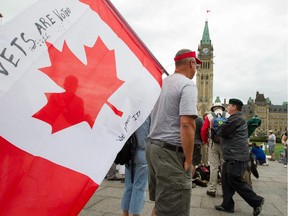 Veterans and their supporters gather on Parliament Hill last June to voice their concerns with cuts.
