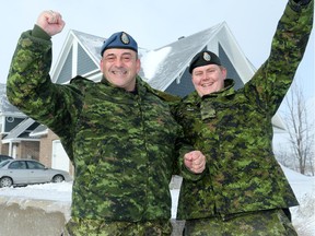Sgt. Mario Legnaro (left) and Cpl. Andrew Price were among the crew of soldiers who helped a family move into their new Habitat for Humanity home in Orléans recently.