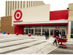 Shoppers leave the Target department store at Billings Bridge Thursday January 15, 2015. Just two years after opening their doors in Canada, Target announced today that it is closing all it's Canadian stores and laying off 17,000 people. (Darren Brown/Ottawa Citizen)