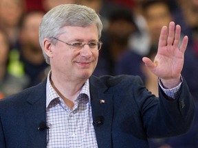 Prime Minister Stephen Harper waves at the crowd in Delta, B.C., on Thursday January 8, 2015.