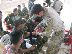 In this official photo released by the Canadian Forces last year, Canadian special forces are shown in Iraq conducting training. The photos were taken from specific angles to prevent the identification of Canadian special forces personnel. Photo courtesy CANSOFCOM