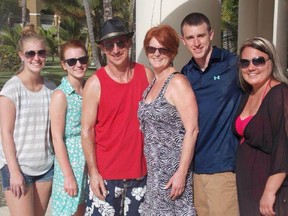 The Snyder family in Punta Cana last week. Andrea Snyder, fourth from left, fell ill on the flight, and her family says the flight crew was slow to summon medical help for the sick woman.