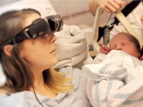 Kathy Beitz, who was diagnosed with a degenerative eye condition called Stargardt's disease at age 11 and is legally blind, sees her newborn baby in this frame from a video her sister posted to YouTube.com.
