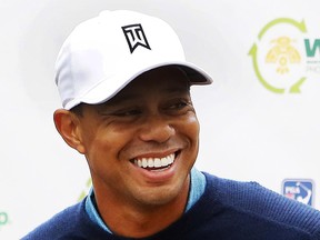 Tiger Woods talks to the media after playing a practice round at the Phoenix Open golf tournament on Tuesday, Jan. 27, 2015, in Scottsdale, Ariz.