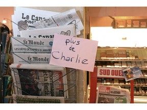 TOPSHOTS A sign which translates as "Charlie Hebdo - Sold Out"  is displayed at a newsagents in Bordeaux on January 14, 2015 as the latest edition of French satirical weekly goes on sale.