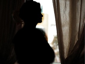 File photo of a woman in silhouette. The necessity to social distance and isolate to stop the spread of COVID-19 means vulnerable women in dangerous situations, who are already isolated by their abusers, are feeling the effects, according to frontline violent-against-women workers.