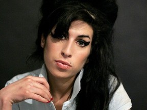 FILE - In this Friday Feb. 16, 2007 file photo British singer Amy Winehouse  after being interviewed by the Associated Press at a studio in north London.