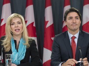 Former Conservative MP Eve Adams (left) is joined by Liberal Leader Justin Trudeau as she announces in Ottawa on Monday, Feb. 9, 2015 that she is leaving the Conservative Party to join the Liberal Party of Canada. THE CANADIAN PRESS/Justin Tang