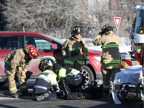 A 15-year-old pedestrian was hit by a red SUV at the intersection of Parkdale Avenue and Scott Street in Ottawa, February 27, 2015.