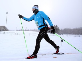A skier heads toward the water station during the Gatineau Loppet in Gatineau, Saturday, February 14, 2015.
