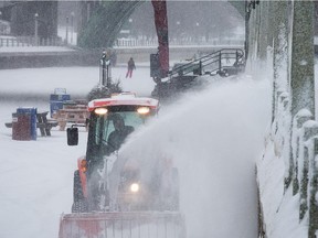 A snowblower clears snow from the Rideau Canal as the region experiences a snowy day on February 2.