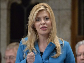 Eve Adams, Conservative MP and Parliamentary Secretary to the Minister of Health, responds to a question during Question Period in the House of Commons, Thursday, Oct.2, 2014 in Ottawa.