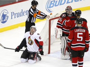 Ottawa Senators right wing Bobby Ryan (6) kneels at the end of an NHL hockey game after missing a chance to score in the final seconds against the New Jersey Devils.