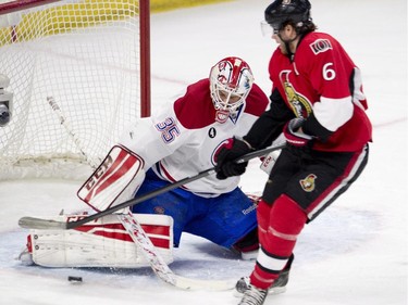 Montreal Canadiens goalie Dustin Tokarski deflects a shot from Ottawa Senators right wing Bobby Ryan during first period NHL action.