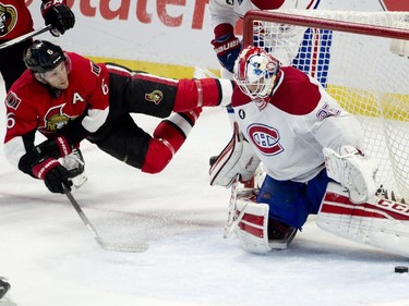 Montreal Canadiens goalie Dustin Tokarski kicks out a diving shot from Ottawa Senators right wing Bobby Ryan during second period NHL action.