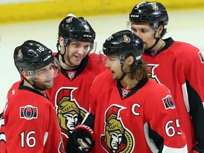 The Ottawa Senators' Bobby Ryan, second from left, celebrates his goal against the Arizona Coyotes with teammates Erik Karlsson (65), Clarke MacArthur (16) and Cody Ceci on Saturday, Jan. 31, 2015. Ryan realizes the Sens need to do something special to get back into the playoff picture, but said, 'You continue to play until they tell you it's mathematically impossible.'
