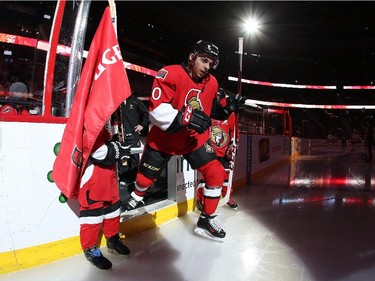 Making his NHL debut, Shane Prince #10 of the Ottawa Senators steps onto the ice during player introductions.
