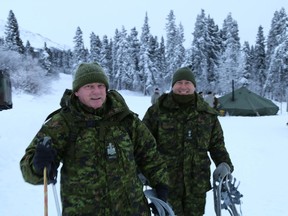 Chief Warrant Officer Steve Merry (left) and Lt. Col. Francois Dufault from the Canadian army are gearing up with their MSR Snowshoes during the three-day Cold Regions Military Mountaineering Collaborative Event at Northern Warfare Training Center's Black Rapids Training Site, Alaska, Feb. 9-12, 2015. The purpose of this event is to strengthen cooperation, share ideas and improve capabilities with our international partners in cold-weather and mountainous regions. Military members from 12 nations are participating in this event, including Canada, Australia, Denmark, Finland, Norway, Sweden, Germany, Japan, Mongolia, Nepal and United Kingdom, as well as various units and service components from across the United States. (Photo by Sgt. Sean Callahan, U.S. Army Alaska Public Affairs)