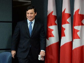 Conservative MP Michael Chong arrives to a press conference in Ottawa on Tuesday December 3, 2013.