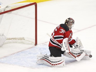 New Jersey Devils goalie Cory Schneider blocks a shot by the Ottawa Senators during the third period.