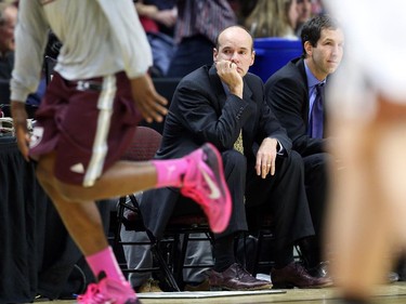Dave Smart, Head Coach of the Carleton University men's basketball team, in action against the University of Ottawa during first quarter action.