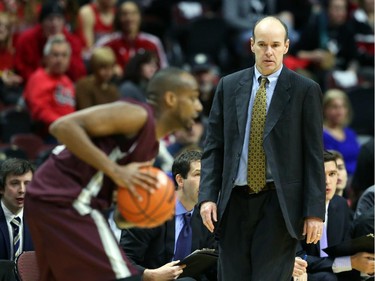 Dave Smart, Head Coach of the Carleton University men's basketball team, in action against the University of Ottawa during first quarter action.