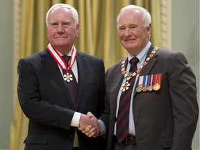 Governor General David Johnston invests Harold Jennings, from Ottawa, as an Officer of the Order of Canada during a ceremony at Rideau Hall in Ottawa on Friday, February 13, 2015.