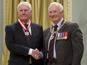 Governor General David Johnston invests Harold Jennings, from Ottawa, as an Officer of the Order of Canada during a ceremony at Rideau Hall in Ottawa on Friday, February 13, 2015.