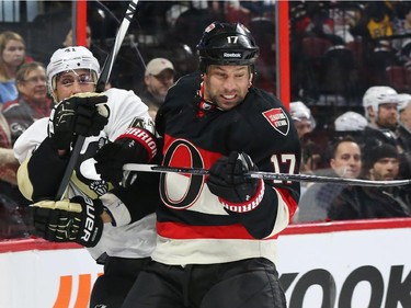 David Legwandof the Ottawa Senators hits Robert Bortuzzo of the Pittsburgh Penguins during first period of NHL action at Canadian Tire Centre in Ottawa, February 12, 2015.