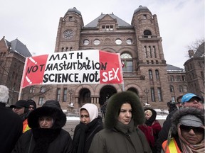 Demonstrators gather in front of Queen's Park to protest against Ontario's new sex education curriculum in Toronto on Tuesday, February 24, 2015.