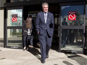 Omar Khadr's defence lawyer Dennis Edney comes out of court after Khadr appeared on court in Edmonton on Sept. 23, 2013.