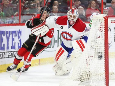 Dustin Tokarski of the Montreal Canadiens blocks Kyle Turris of the Ottawa Senators during first period NHL action.