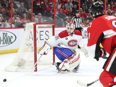 Dustin Tokarski of the Montreal Canadiens makes the save on Mark Stone of the Ottawa Senators during first period NHL action.