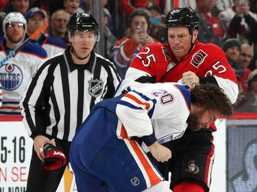 OTTAWA, ON - FEBRUARY 14: Chris Neil #25 of the Ottawa Senators fights Luke Gazdic #20 of the Edmonton Oilers in the second period at Canadian Tire Centre on February 14, 2015 in Ottawa, Ontario, Canada.