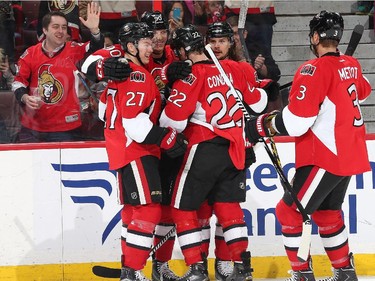 OTTAWA, ON - FEBRUARY 14: Alex Chiasson #90 of the Ottawa Senators celebrates his second period goal with team mates Curtis Lazar #27, Erik Condra #22, Erik Karlsson #65 and Marc Methot #3 against the Edmonton Oilers at Canadian Tire Centre on February 14, 2015 in Ottawa, Ontario, Canada.