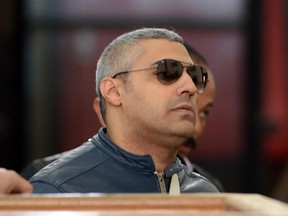 Al-Jazeera journalist Egyptian-Canadian Mohamed Fahmy arrives at the court in Cairo for his retrial on February 12, 2015.