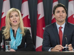 Former Conservative MP Eve Adams is joined by Liberal Leader Justin Trudeau as she announces in Ottawa on Monday, Feb. 9, 2015 that she is leaving the Conservative Party to join the Liberal Party of Canada.
