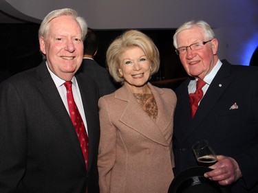 From left, lawyer Greg Kane with his wife, Adrian Burns, a director with Shaw Communications, and Hugh Winsor at a special event organized by the Macdonald-Laurier Institute at the Canadian Museum of History on Wednesday, February 18, 2015.