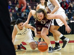 Kellie Ring of the University of Ottawa Gees, centre, dominated in Wednesday's convincing victory over the Carleton Ravens.