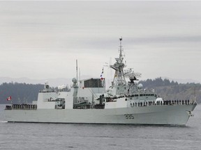 HMCS Calgary returns to Victoria on Oct. 24, 2008. The former second-in-command of the Canadian warship has been charged with disobeying orders and drunkenness.